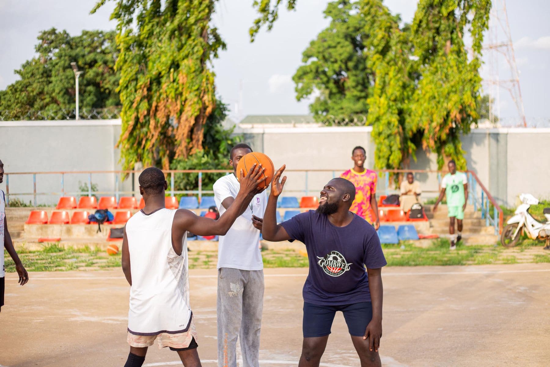 Friends playing an outdoor basketball game together